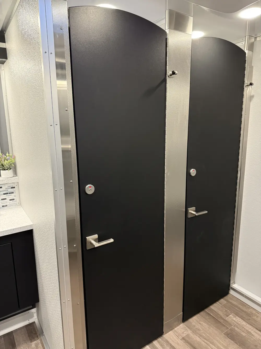 Portable restroom trailer setup at outdoor event in Newark