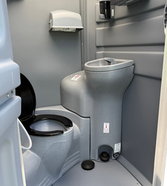 Portable restroom trailer setup at outdoor event in Newark